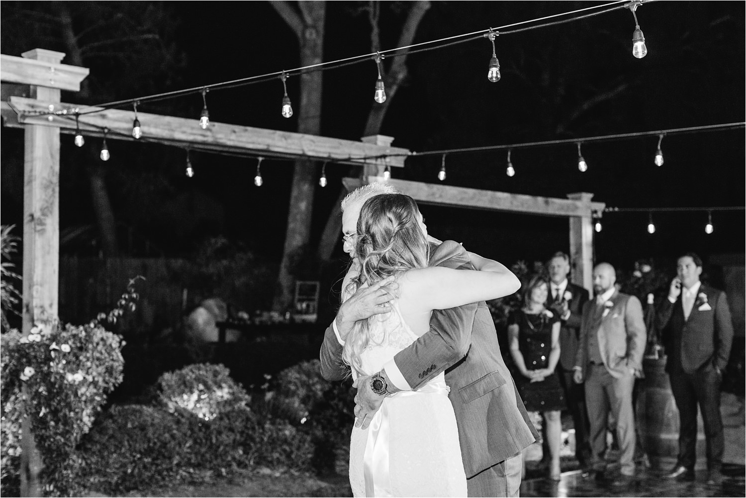 Bride gives her hug a dad during the father daughter dance - https://brittneyhannonphotography.com