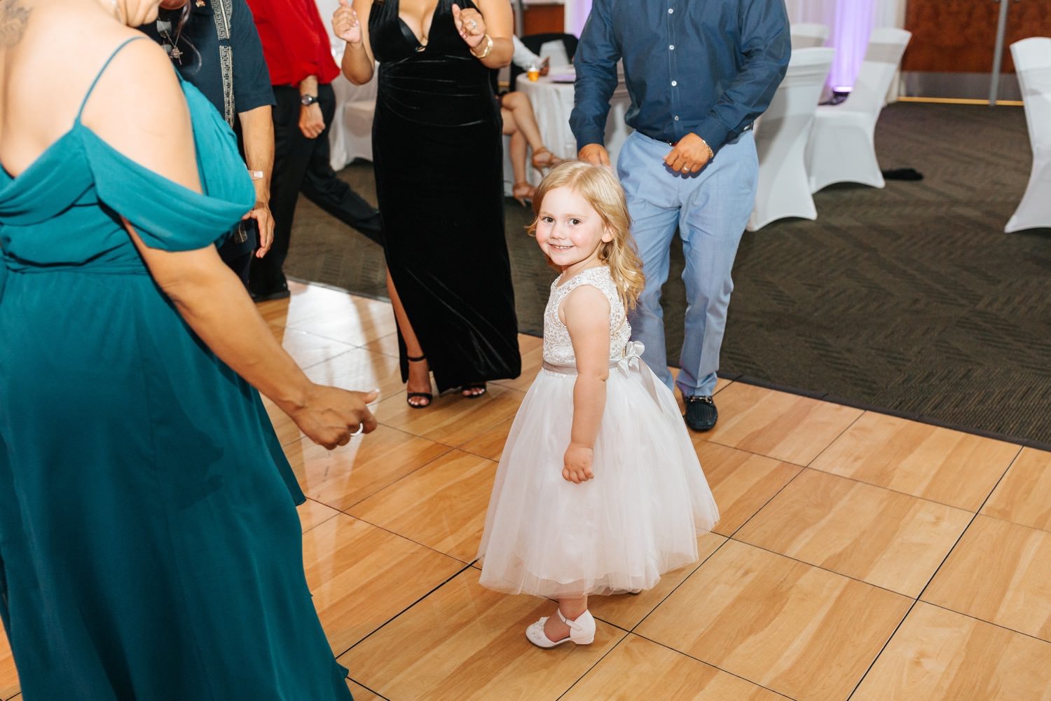 Flower girl dancing during wedding reception - https://brittneyhannonphotography.com