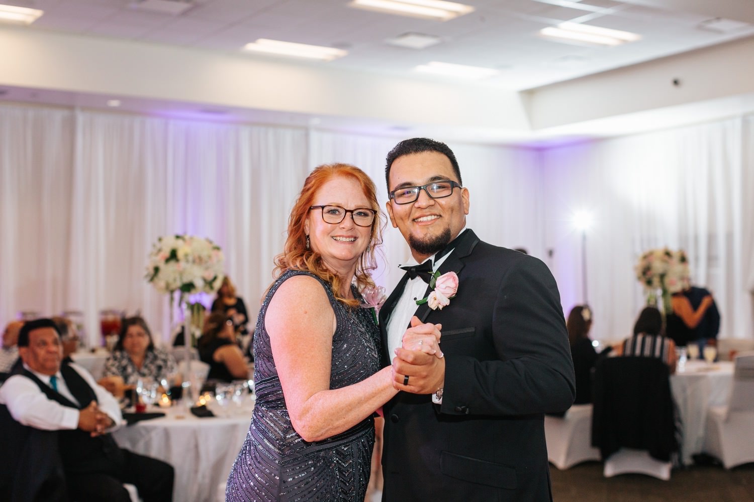 Groom dances with brides mom - https://brittneyhannonphotography.com