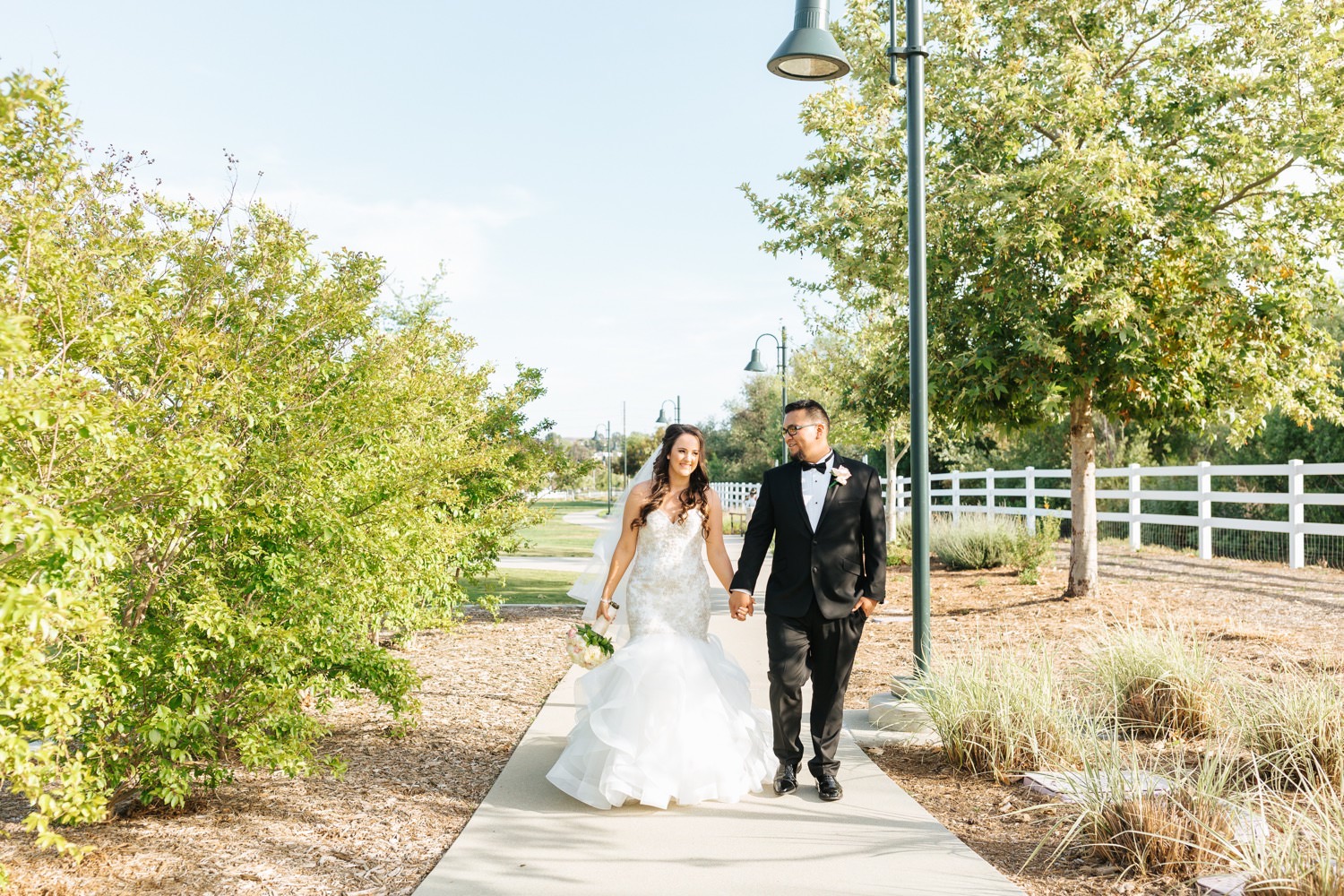Bride and Groom Walking - https://brittneyhannonphotography.com