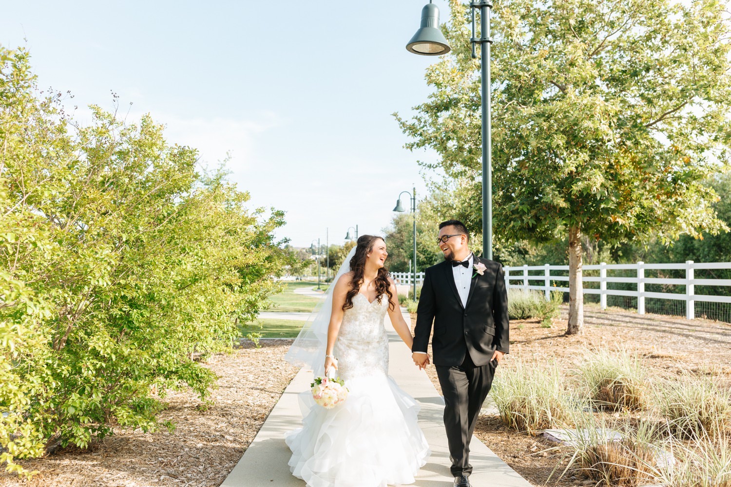 Bride and Groom Walking - https://brittneyhannonphotography.com