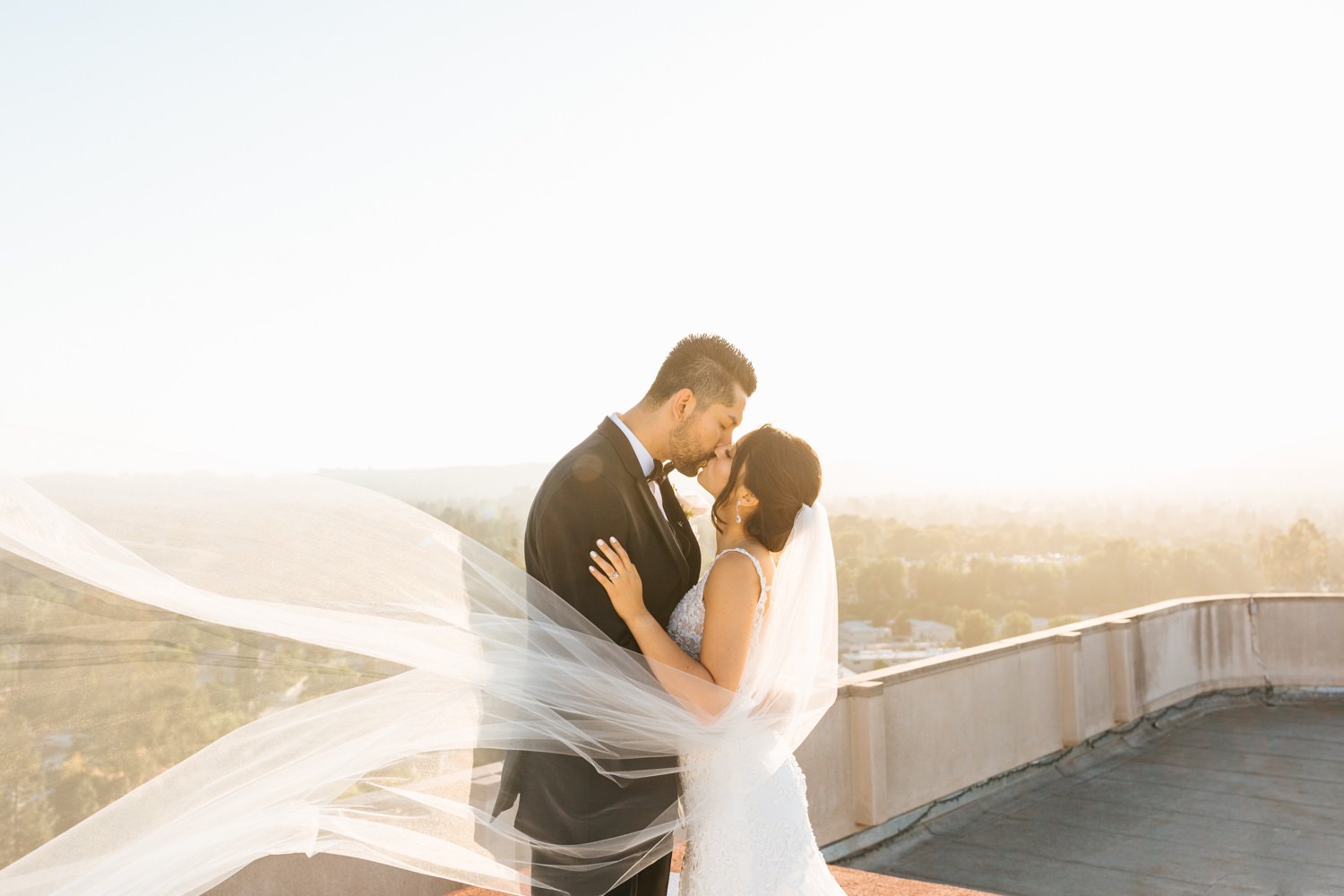 LA rooftop wedding photos - romantic bride and groom photos - veil wedding photos - https://brittneyhannonphotography.com